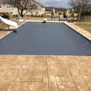 Technician with closed automatic pool cover