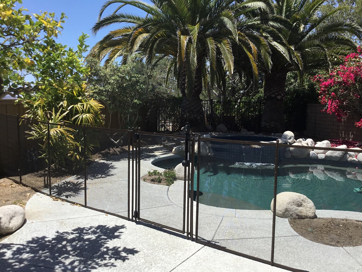 pool fence surrounding pool and decking
